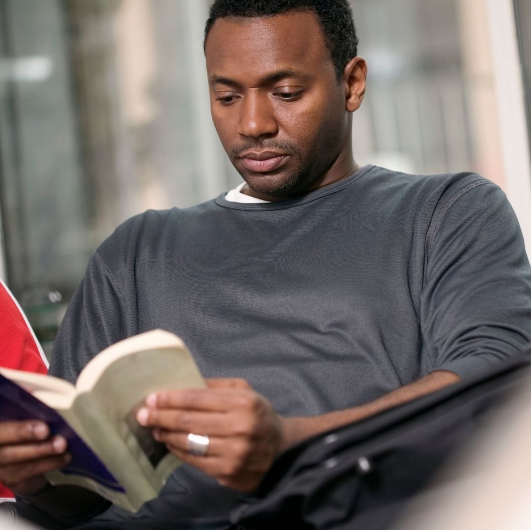 African American man reading a book